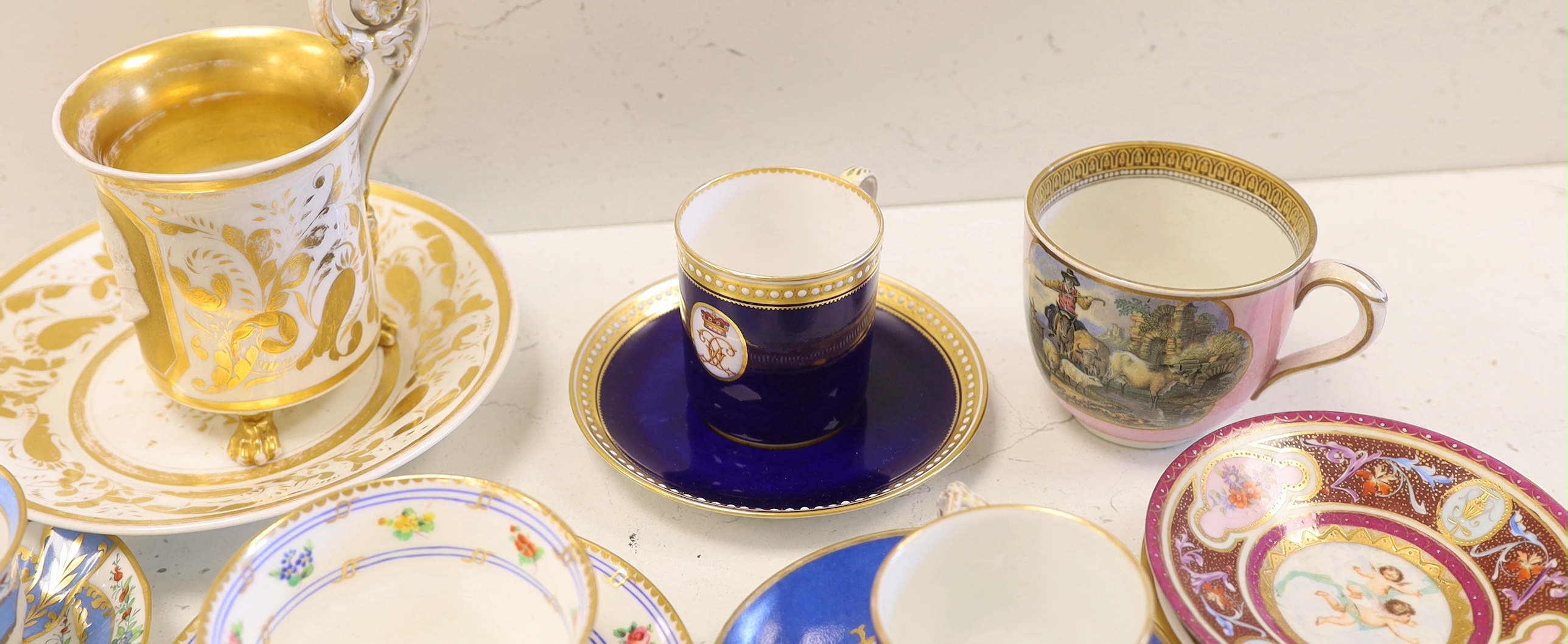 A collection of European cabinet cups and saucers, including a gilded Berlin cup and saucer (12)